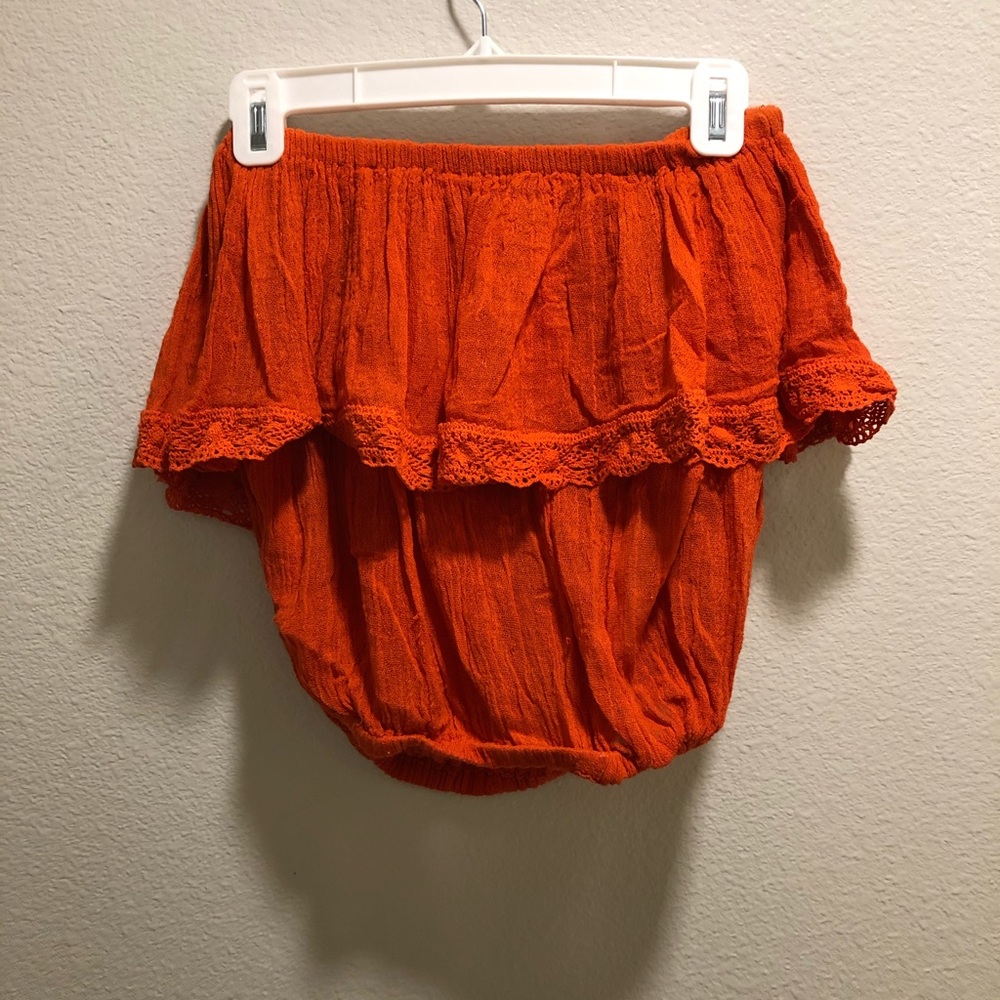 Jen’s Pirate Booty red off-the shoulder top.